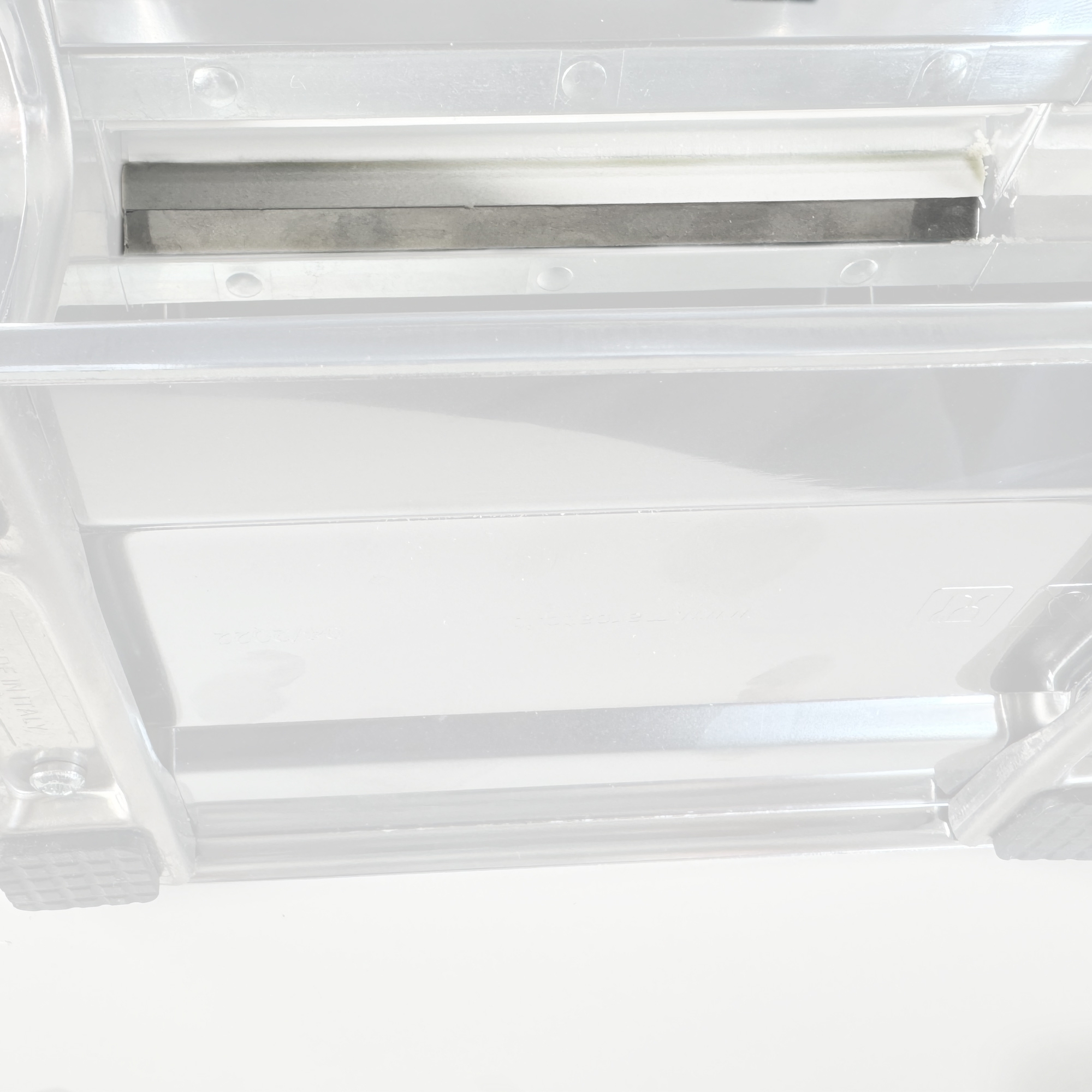 Close-up of stainless steel blade in plastic housing